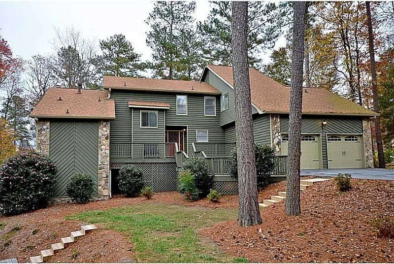 Exterior Front. Update home on huge golf course lo