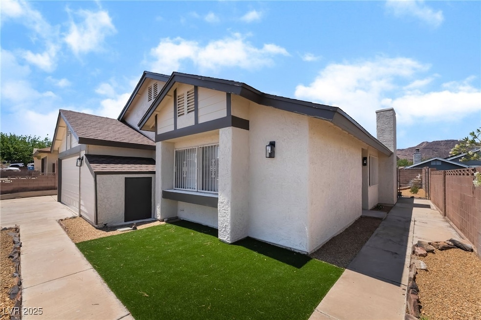View of side of home featuring stucco siding and a