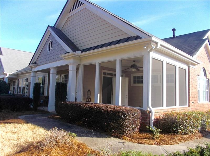Front Elevation with Patio at Front Door and View 
