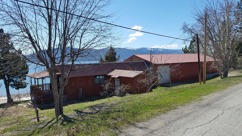 West Lot with Shop & Trailer
