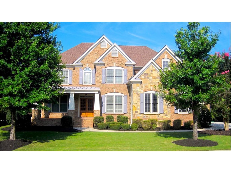 This home has great curb appeal with a brick and s