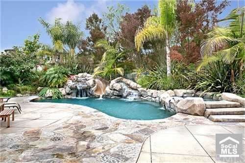 Private Backyard with Lush, Tropical Surrounds fea