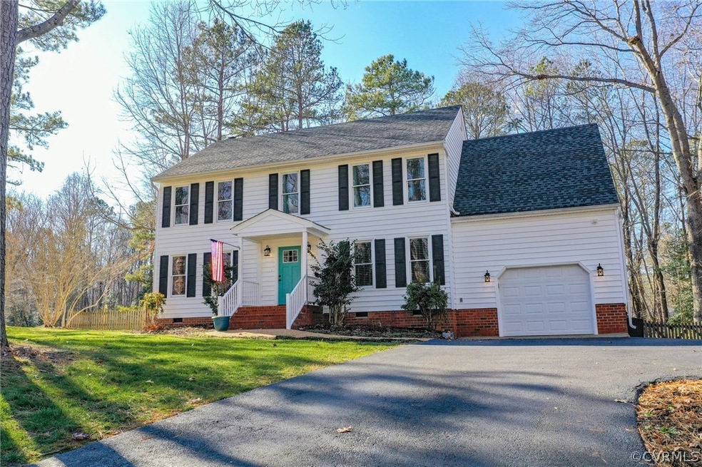 Front View showing double wide driveway and side p