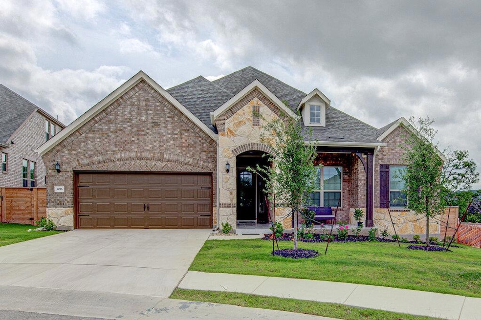 French country inspired facade featuring stone si