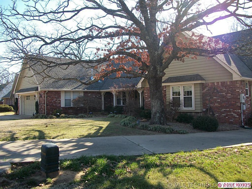 Front view with 2nd driveway to separate 3rd car g