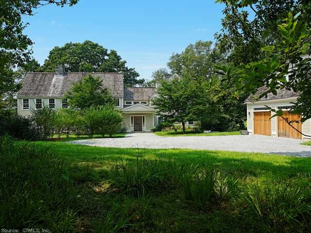 Exterior Front. Circular stone driveway provides a