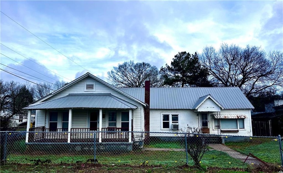 View of front of house featuring a porch and a fro
