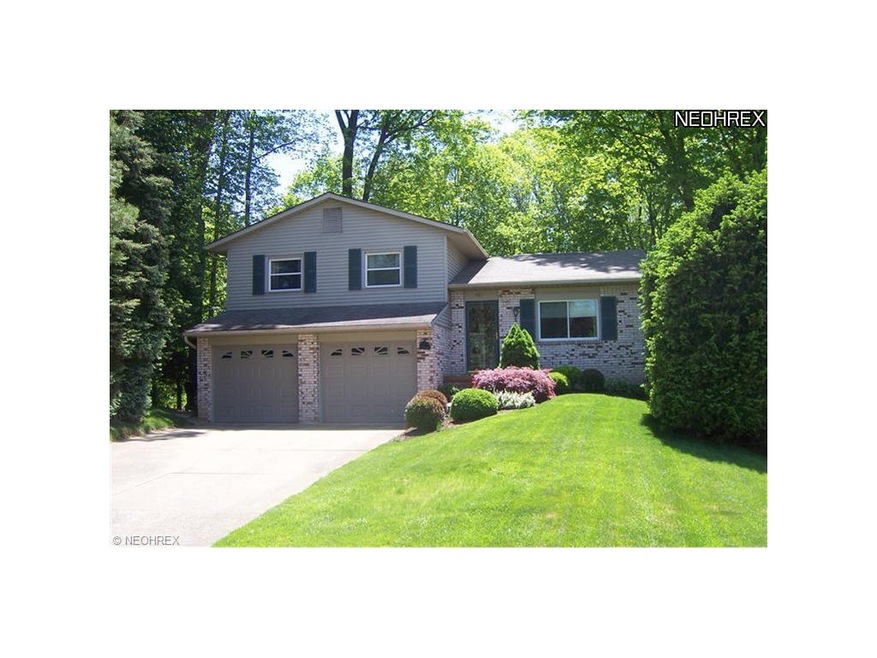 Front view of home. Newer insulated garage doors w