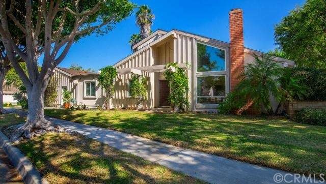 Corner home surrounded by tree, lush landscape, wa