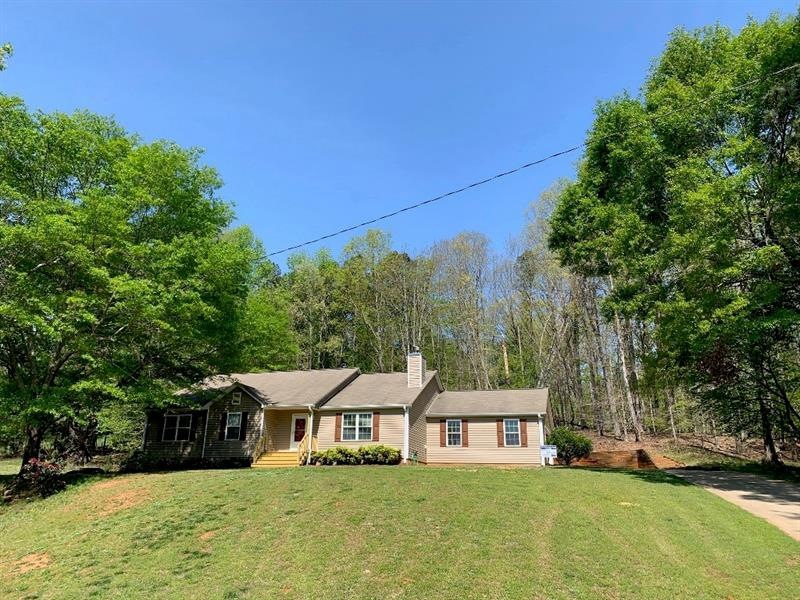 Lovely hillside retreat on 1.63 acres. Convenient 