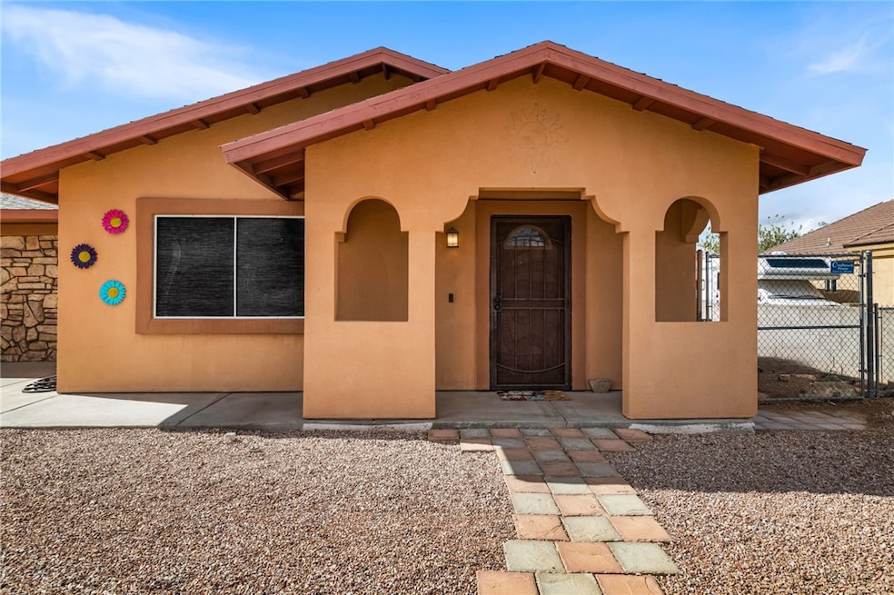 View of front of property featuring stucco siding and a porch