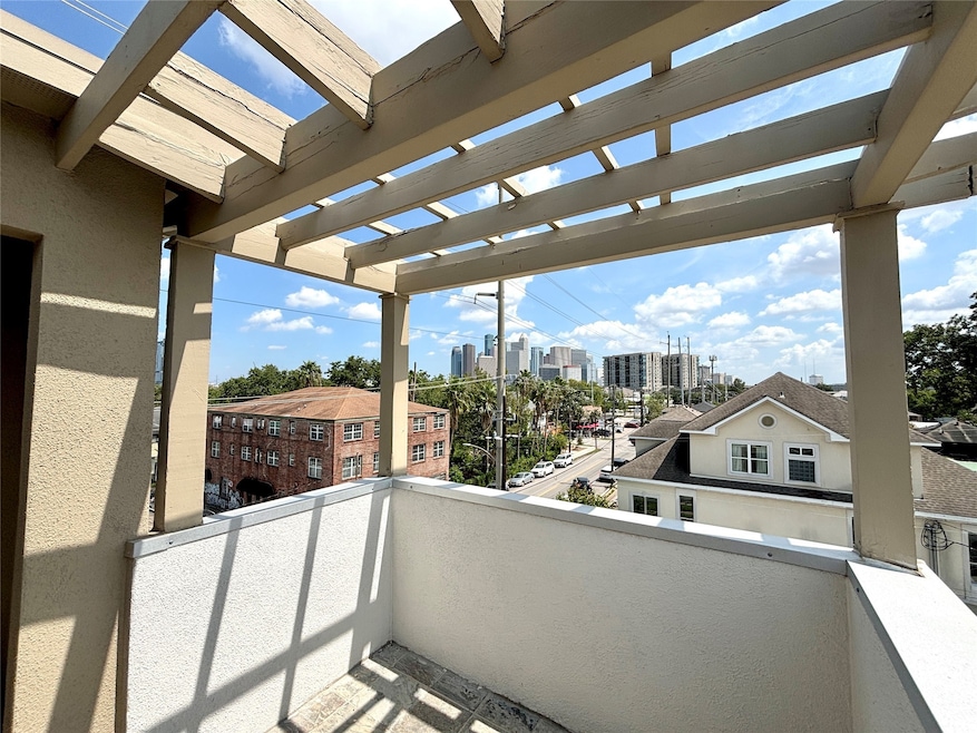 Welcome to 2402 Morgan St A, featuring a 4th floor rooftop deck with an unobstructed view of Downtown, Houston