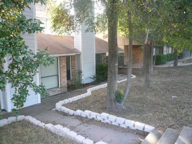 View of property hidden behind natural elements