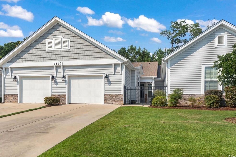View of front facade featuring a garage and a fron