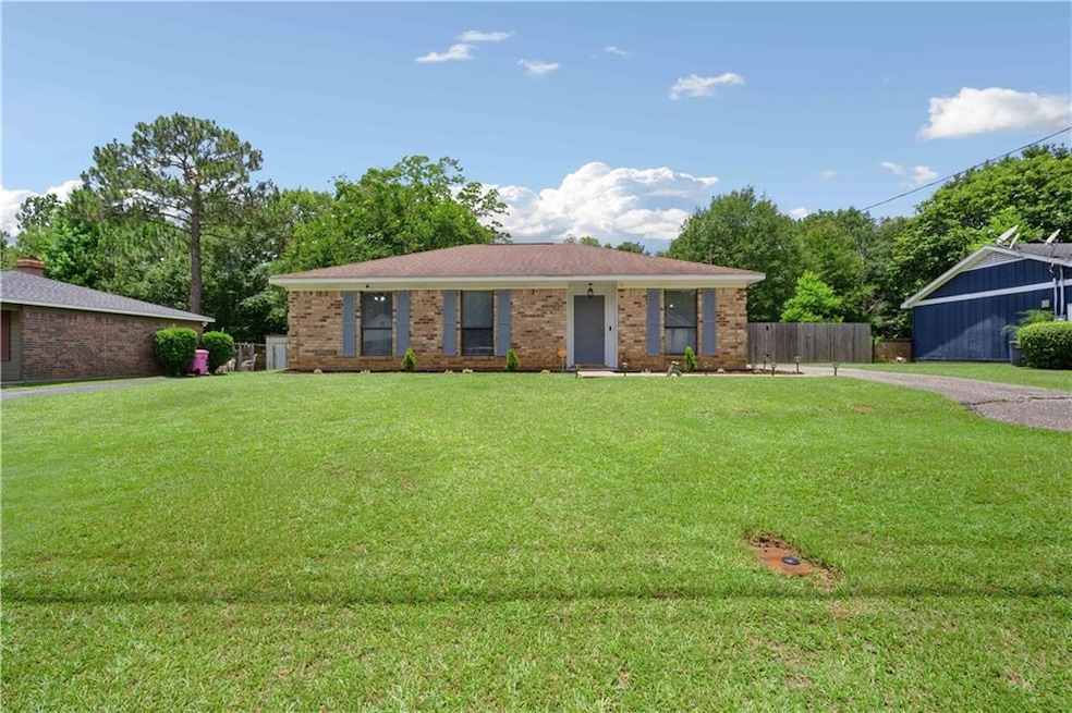 Ranch-style home with brick siding