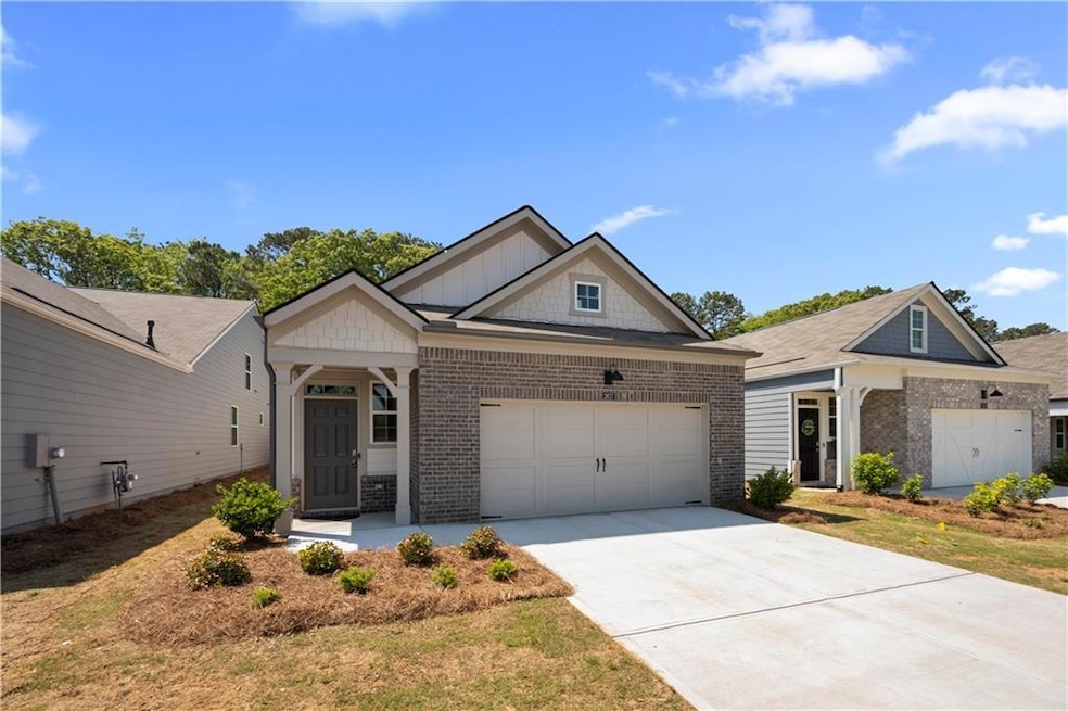 Traditional-style home with brick siding, an attac