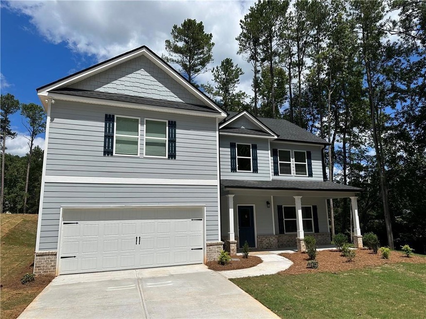 View of front of property featuring a garage and a