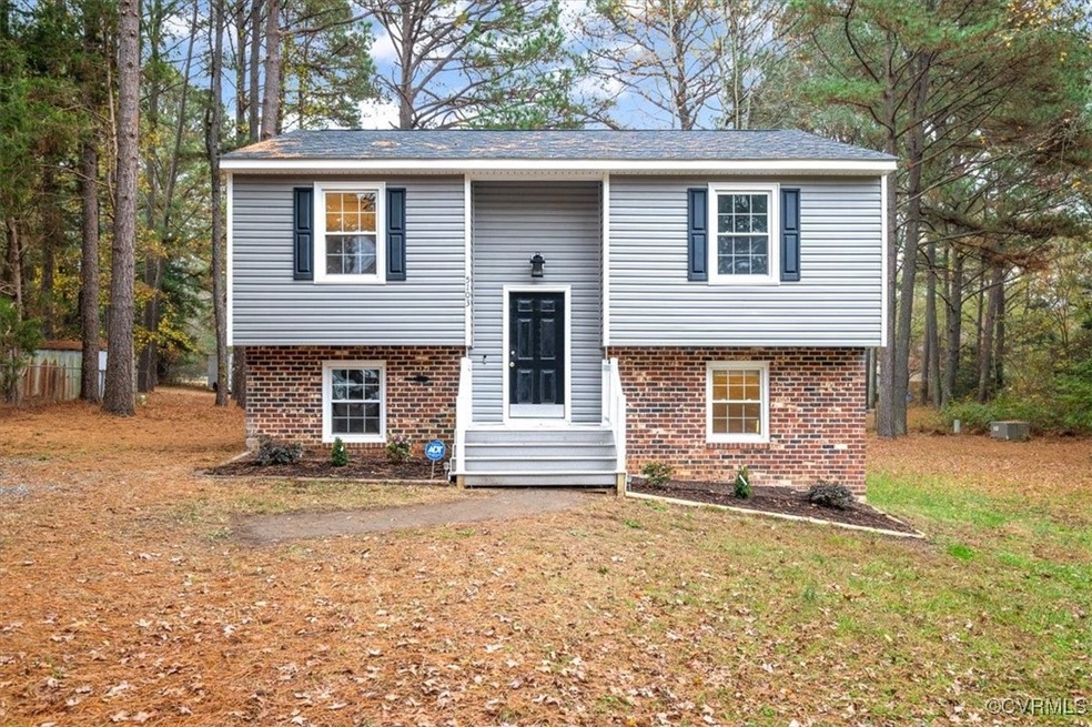 Raised ranch with a front lawn