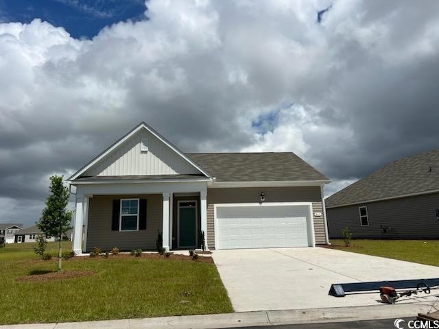 View of front of property with a front yard and a 