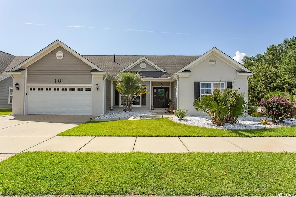 Ranch-style house featuring a garage and a front l