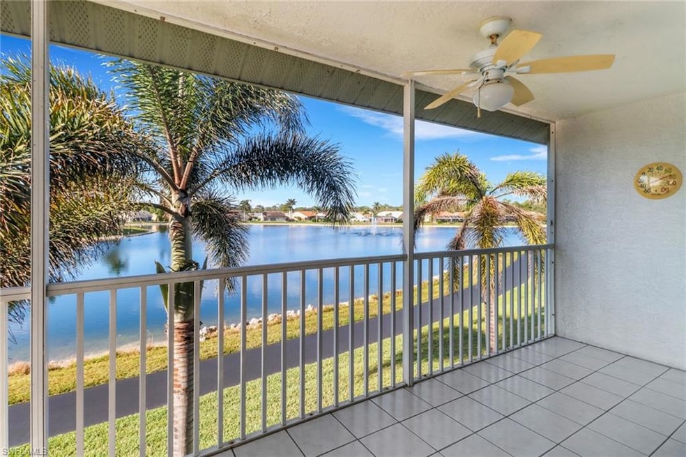 Sunroom / solarium with a water view and ceiling f