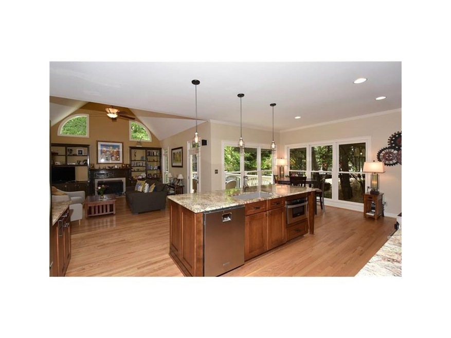 Kitchen is open to family room with views also on 