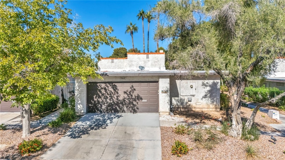 Mediterranean / spanish house featuring driveway and stucco siding