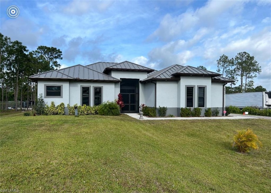 View of front of home featuring a standing seam ro