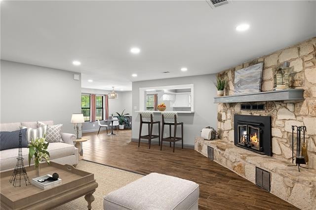 Family living area surrounded by grand fireplace