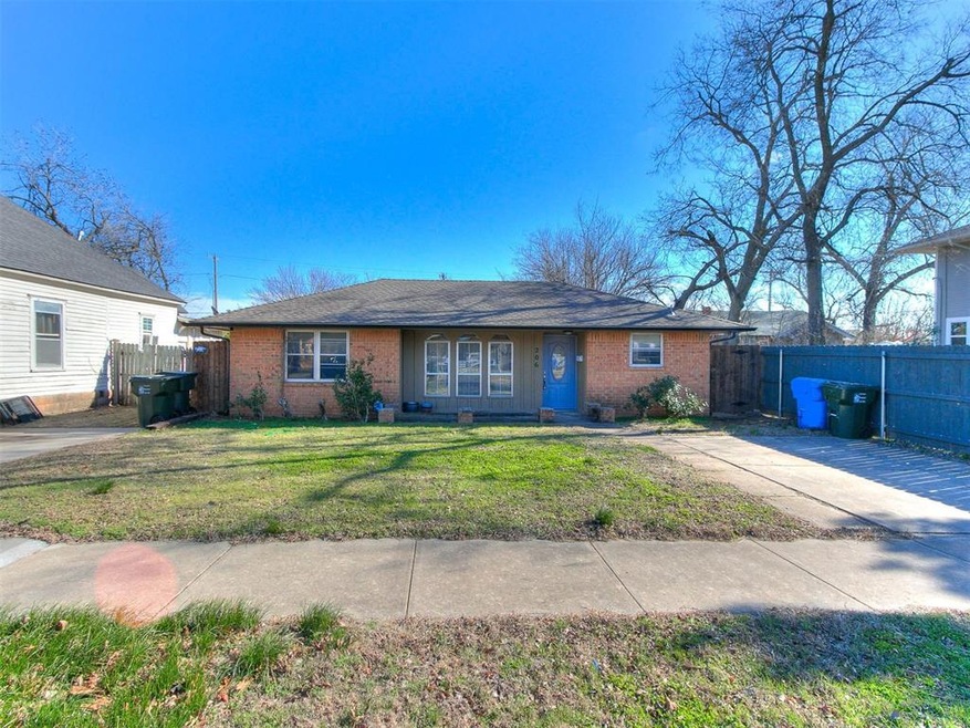 Single story home featuring a front lawn