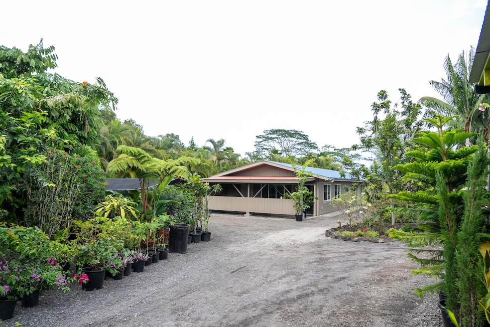 As you enter the property and stroll past the luscious garden, the house is to your right with the lanai out front