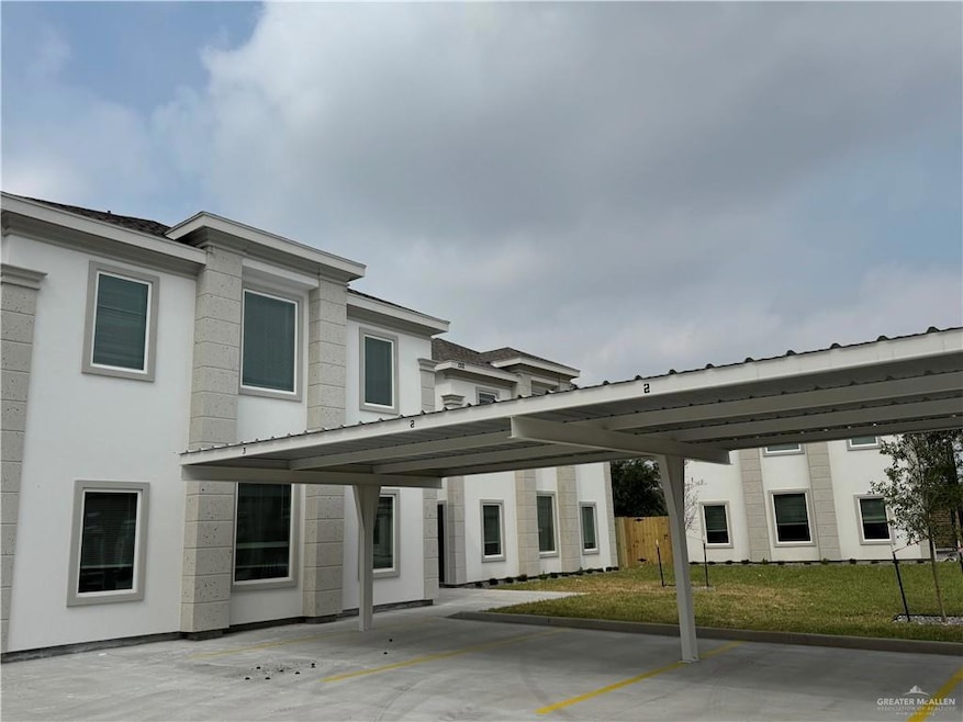 View of building exterior with covered parking