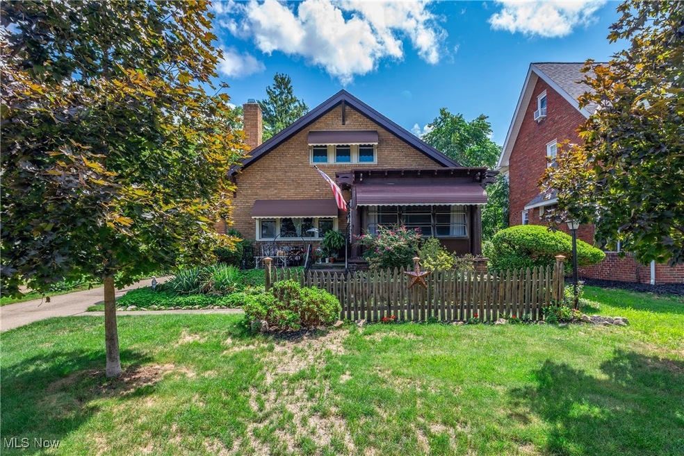 View of front of property with a front yard