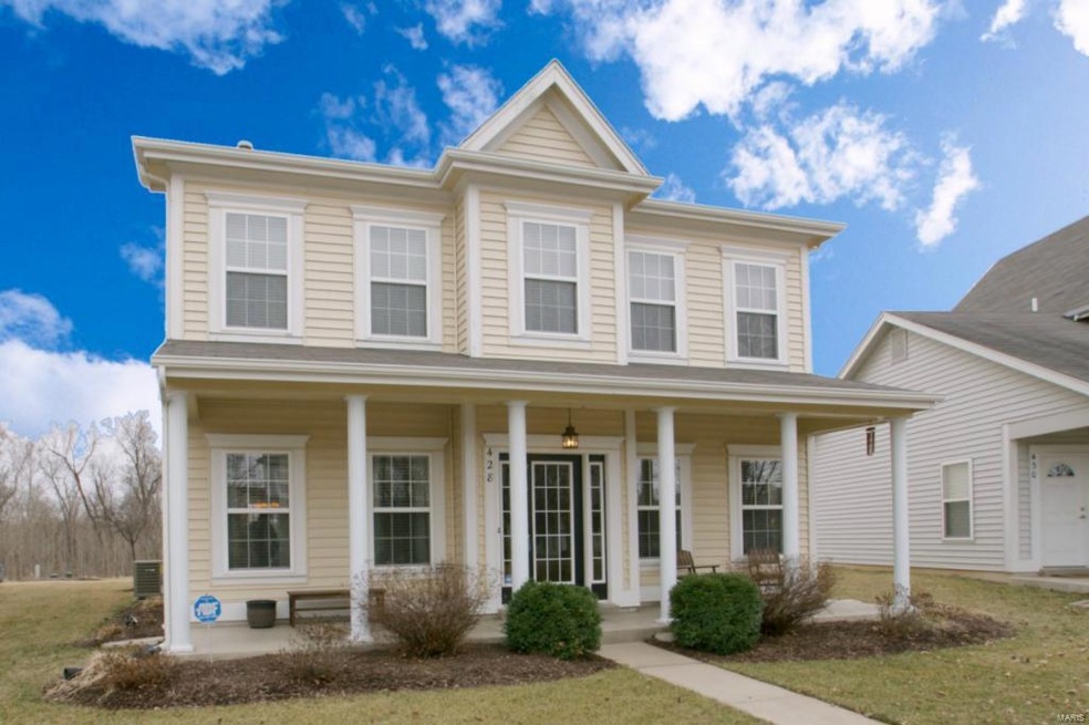 1.5 Story w/ large covered front porch and backs t