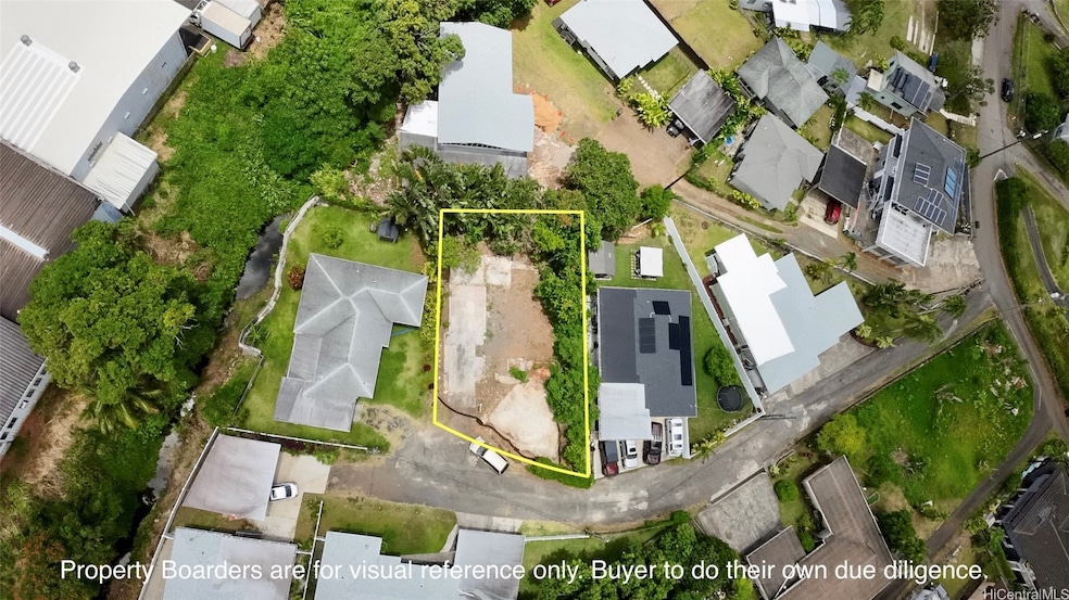 Aerial view of the lot, Pahia Road and neighbors.