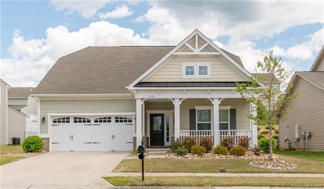 A Covered front porch with plenty of room for seat