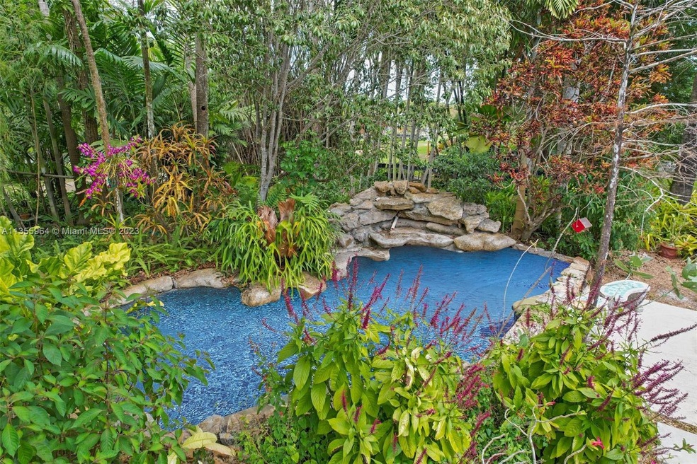 5.1 ACRE ( 3 FOLIOS)  LUSH LANDSCAPING WITH FLORIDA NATIVE SPECIMENS SURROUND THIS 3/2 FLORIDA HOME WITH  WATER FEATURE IN ADDITION TO CONTAINER NURSERY SET UP...AMAZING VIBE. 2 ENTRANCES BOTH OFF MAIN PAVED ROADS