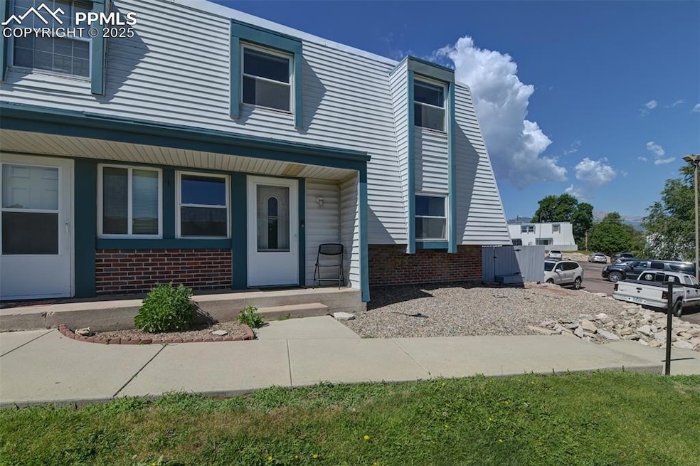 View of front of house with brick siding
