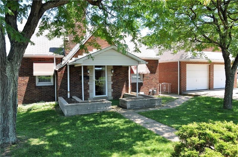 Front of home, showing built in planters and 2 sto