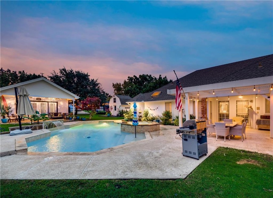 Back yard oasis with a heated volleyball pool (dee
