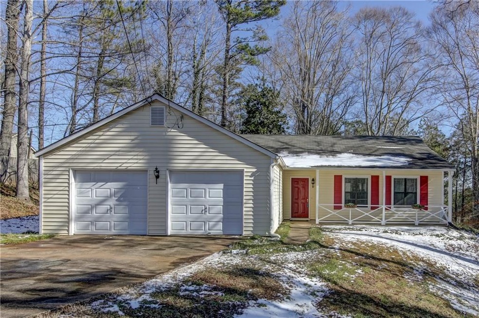 Charming 3/2 ranch surrounded by beautiful trees.