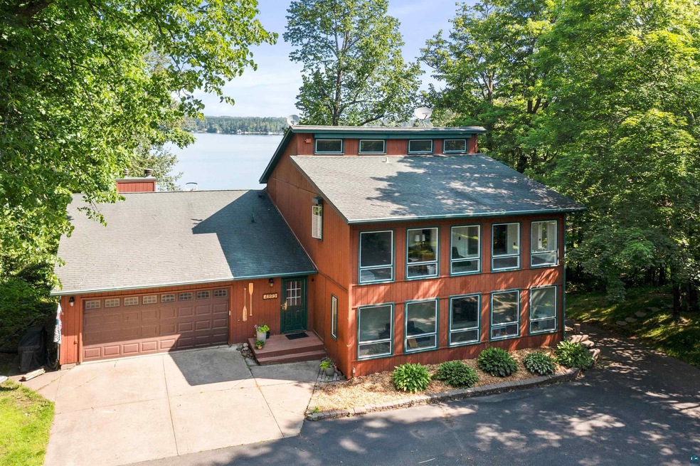 View of front of house with a water view