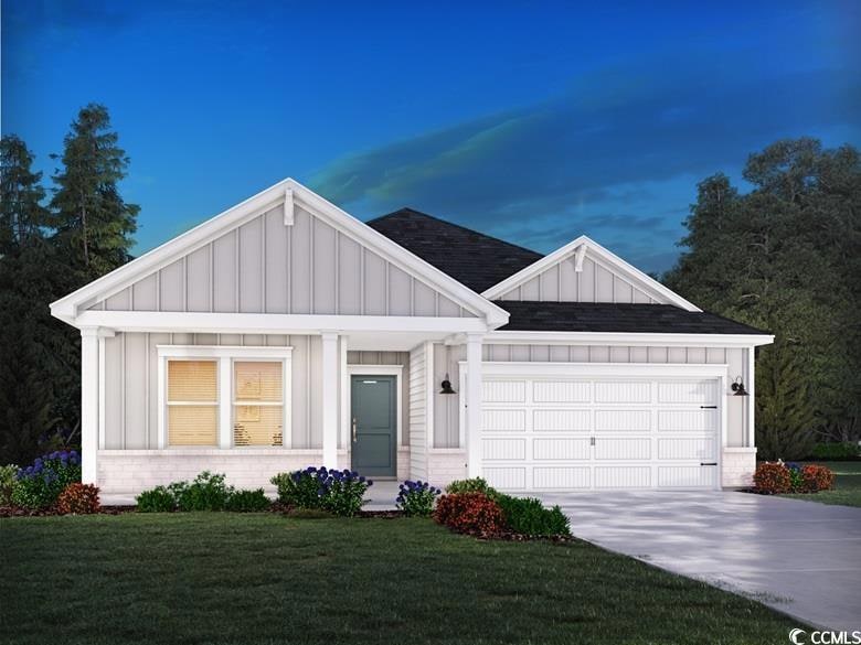View of front of home featuring concrete driveway,