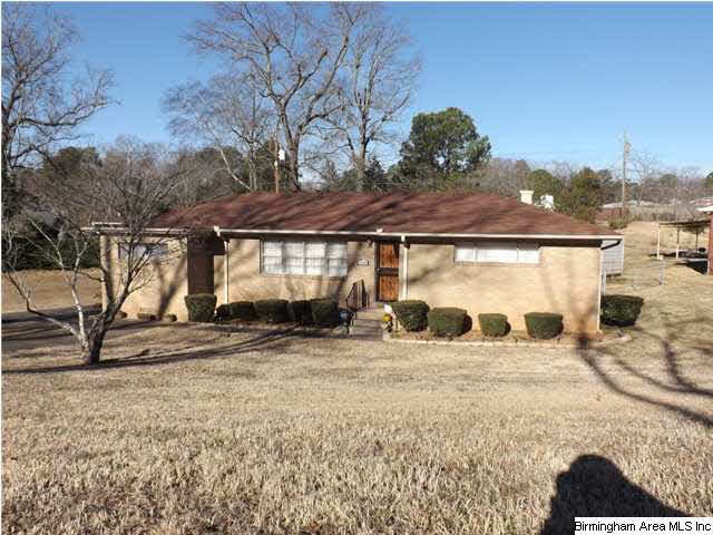 Well-kept full-brick home on corner lot.