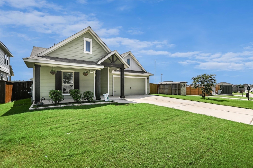 View of front of house with concrete driveway, a 