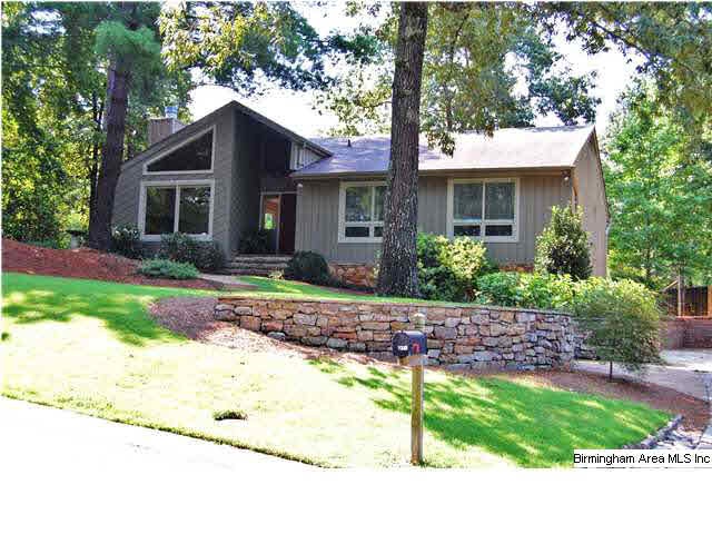 THE FRONT LAWN W/MATURE LANDSCAPE AND ROCK WALL AC