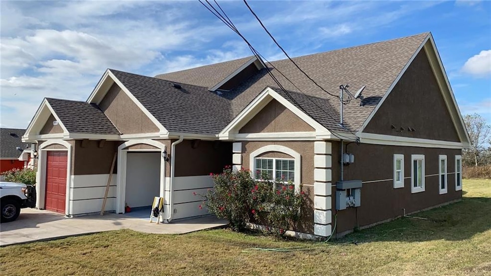 View of front of house with an attached garage, r