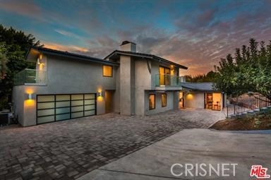 Front of home at Dusk behind electronic Gate