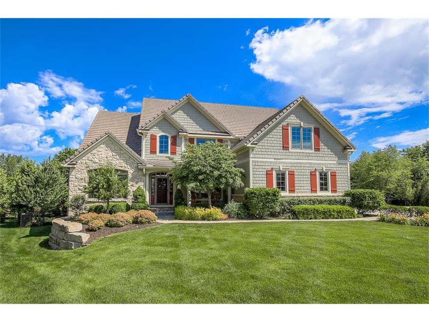 Beautiful curb appeal with lush landscape around p