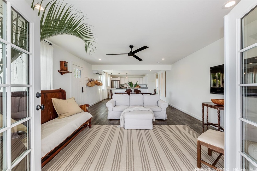 Enter the French doors from the large lanai to the